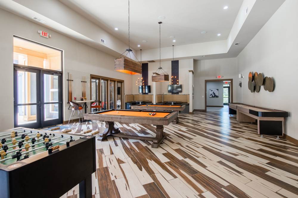 Resident recreation room with pool table at The Quarters at Stillwater in Stillwater, Oklahoma