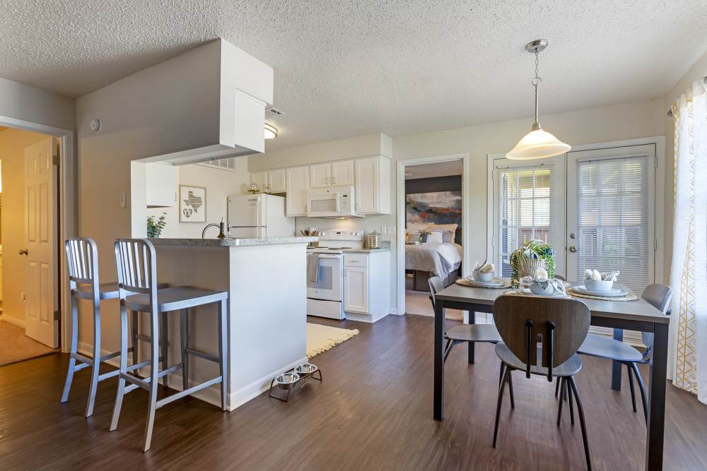 Spacious open concept apartment with eat-in kitchen and dining area at The Landing at College Station in College Station, Texas