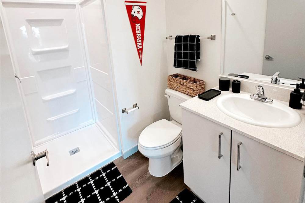 Bathroom with large mirror at LivRed in Lincoln, Nebraska