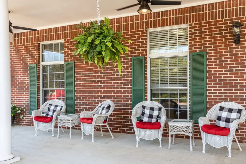 Seating on the covered front porch at Concord Place in Concord, North Carolina