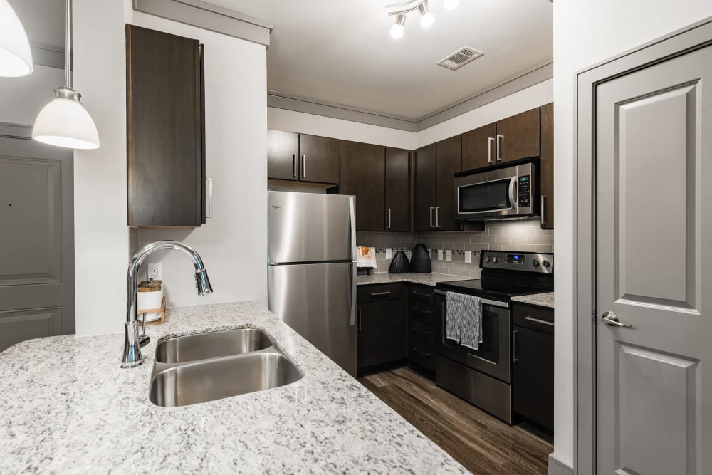 Stainless-steel appliances in a modern kitchen at Marquis Seven Meadows in Katy, Texas