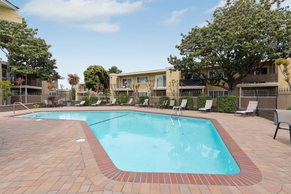 Outdoor swimming pool and expansive pooldeck at Pentagon Apartments in Fremont, California