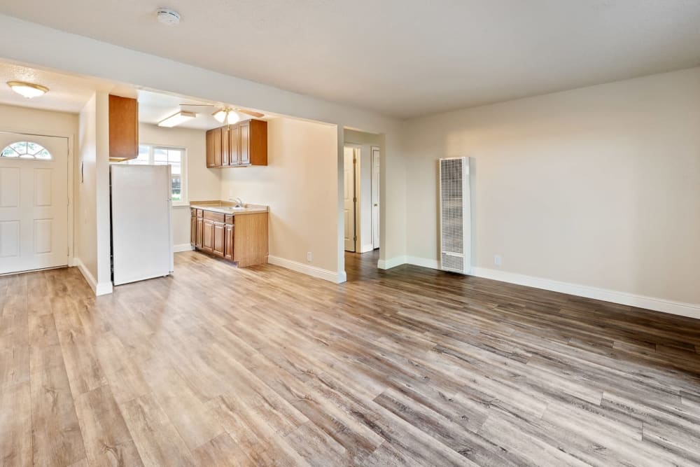 Spacious apartment with wood-style flooring at Mountain View Apartments in Concord, California