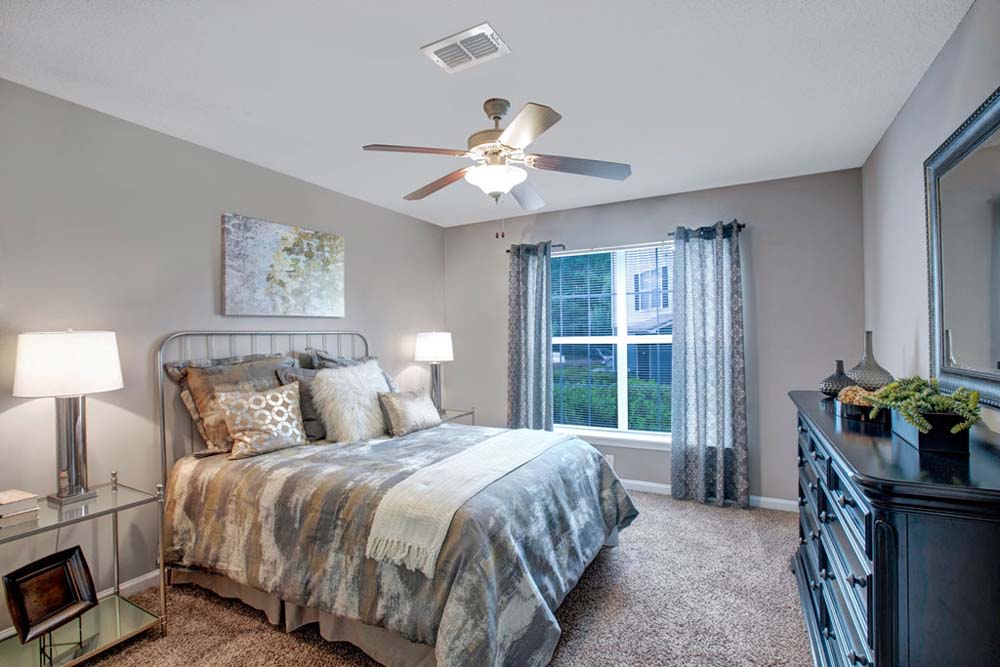 Well-lit bedroom at Apartments in Jonesboro, Georgia