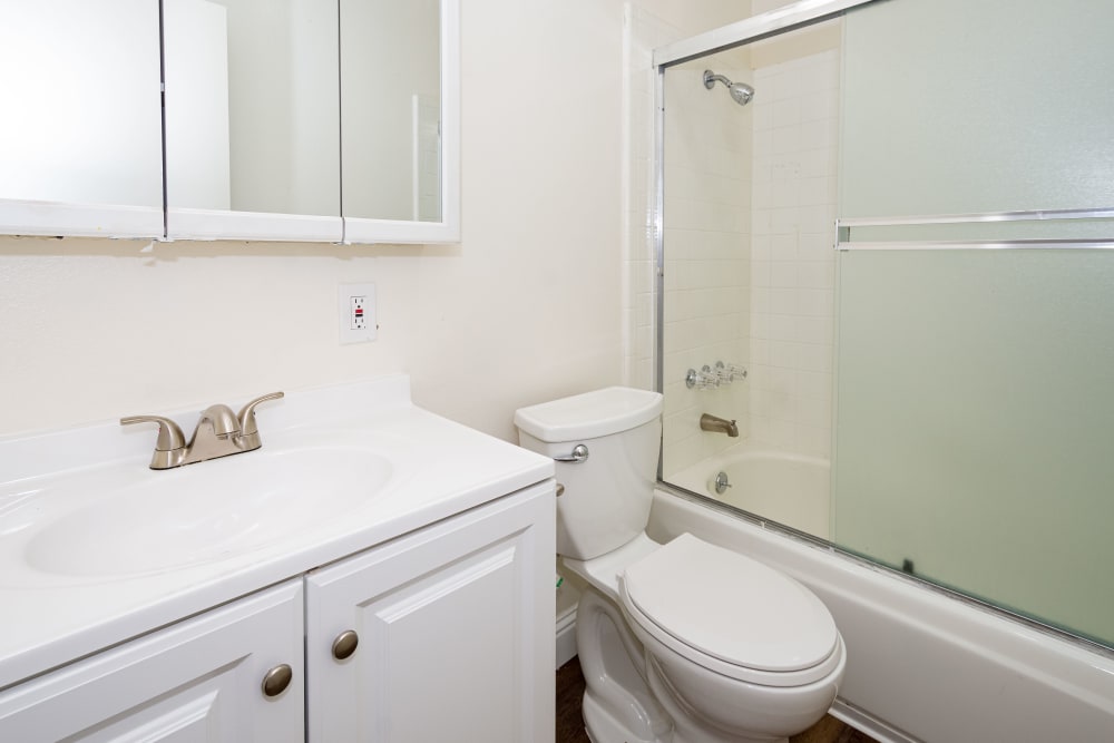 Bathroom with sink and toilet at Bayfair Apartments in San Lorenzo, California