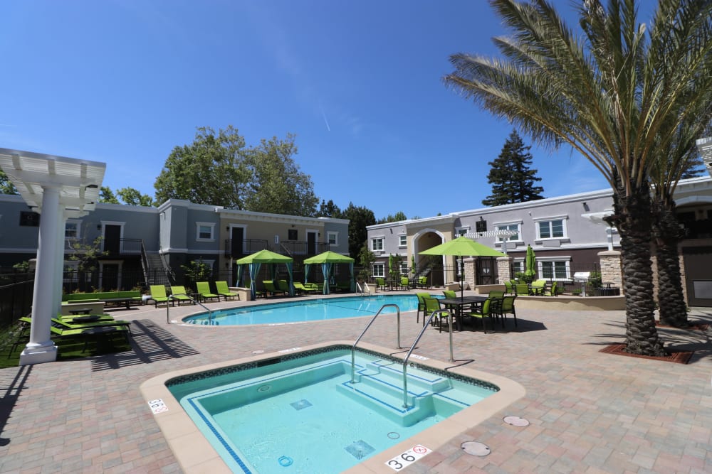 Outdoor swimming pool and spa at Ramblewood Apartments in Fremont, California