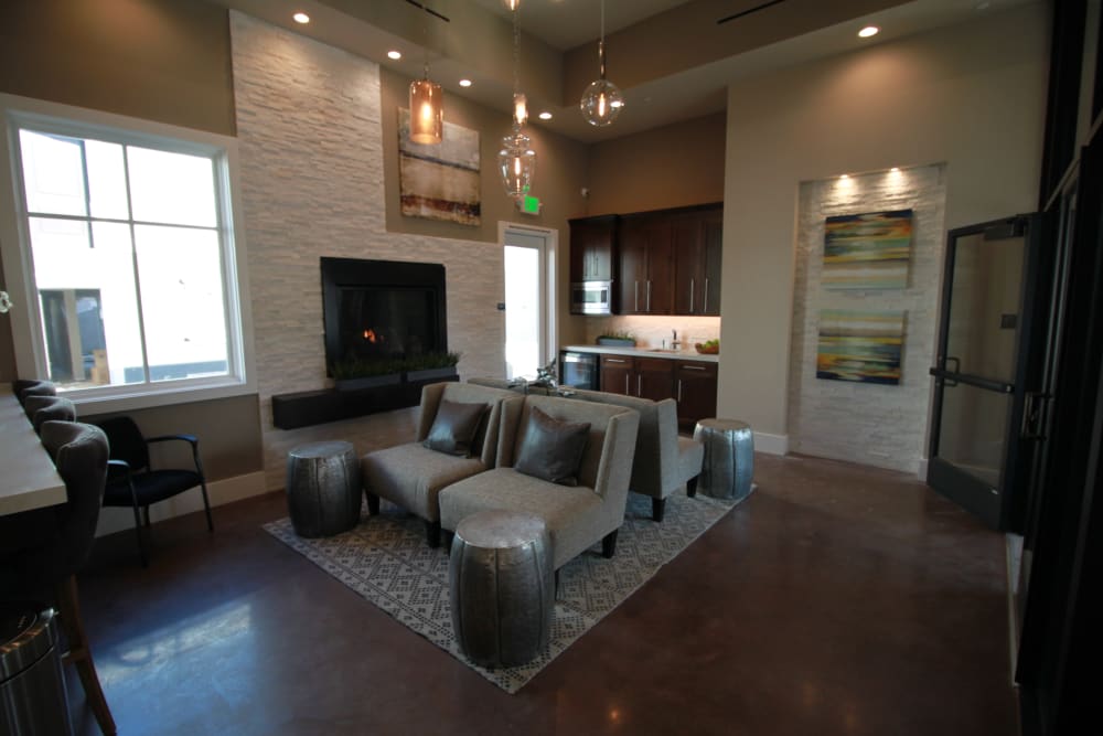 Resident clubroom with a gas fireplace at Ramblewood Apartments in Fremont, California