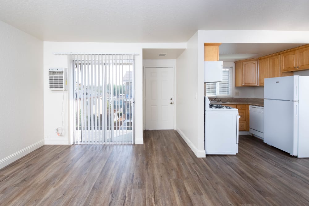 Spacious apartment with wood-style flooring at Alderwood Park Apartments in Livermore, California