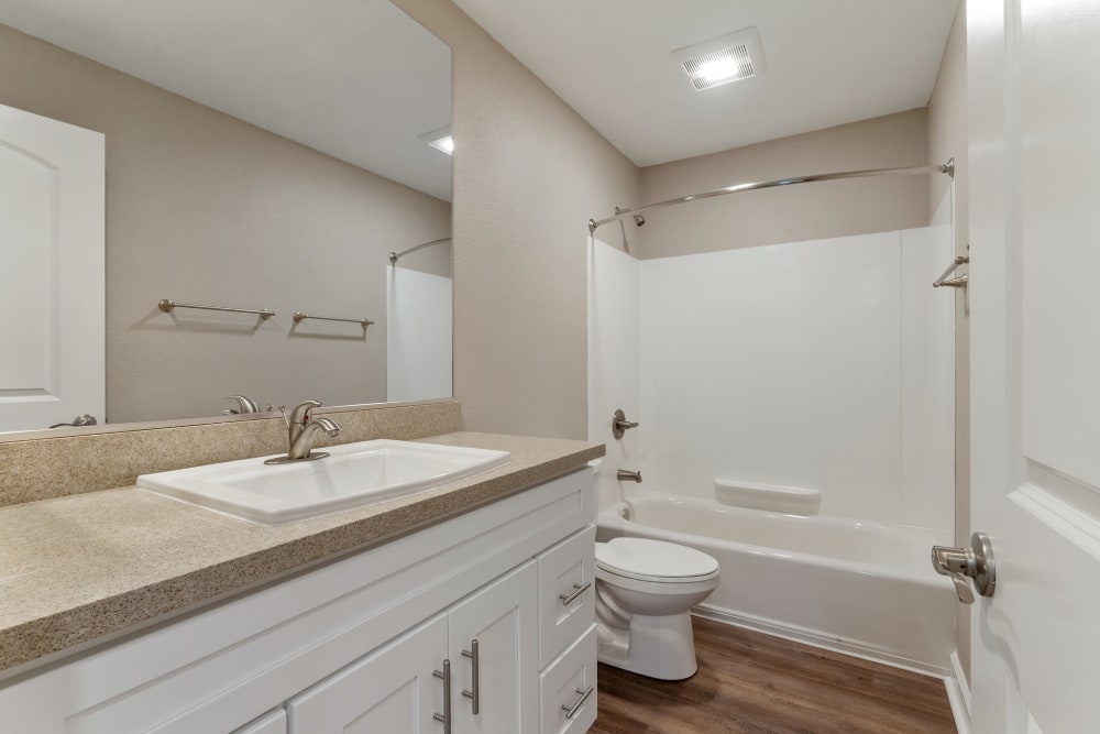 Bathroom with oversized vanity and tub/shower combination at Vista Creek Apartments in Castro Valley, California