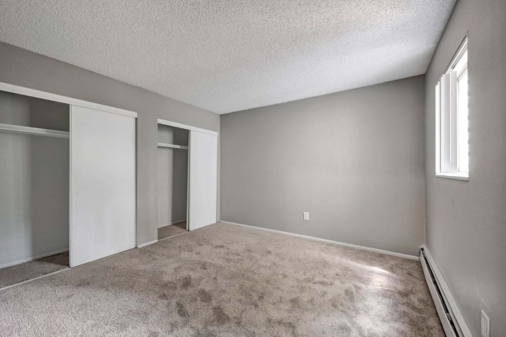 Room with closet at Arvada Green Apartment Homes in Arvada, Colorado
