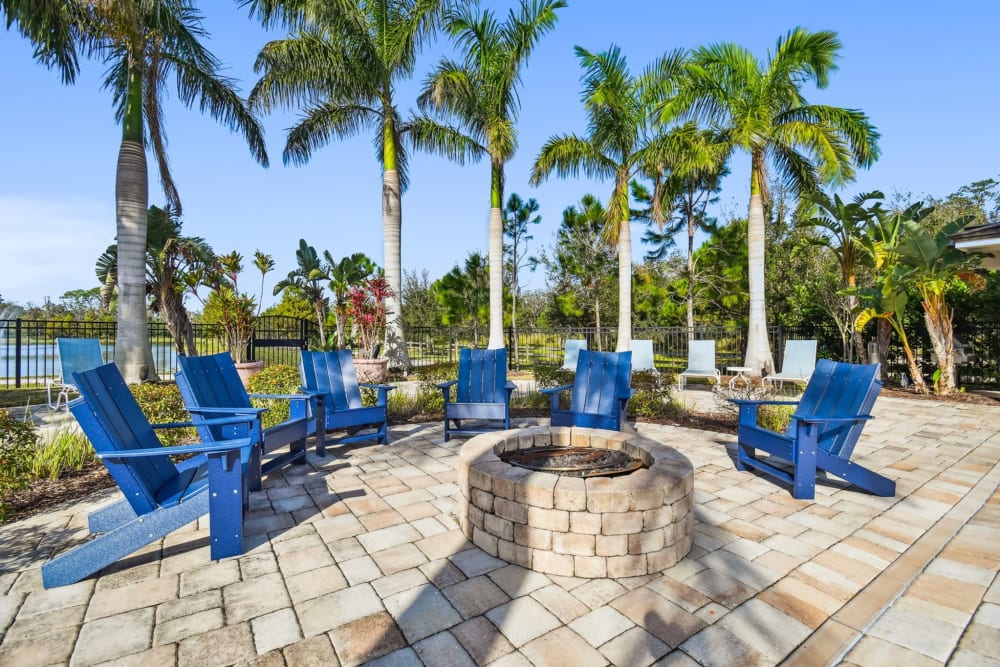Outdoor seating and fire pit at Goldelm at Bennett Park in Bradenton, Florida