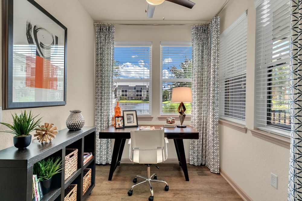 Office space with multiple windows at Art Avenue Apartment Homes in Orlando, Florida