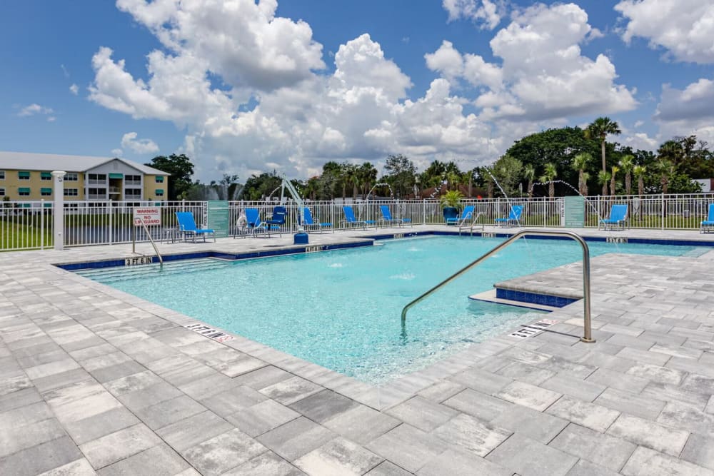 Swimming pool and sun deck at Waterline Bonita Springs in Bonita Springs, Florida