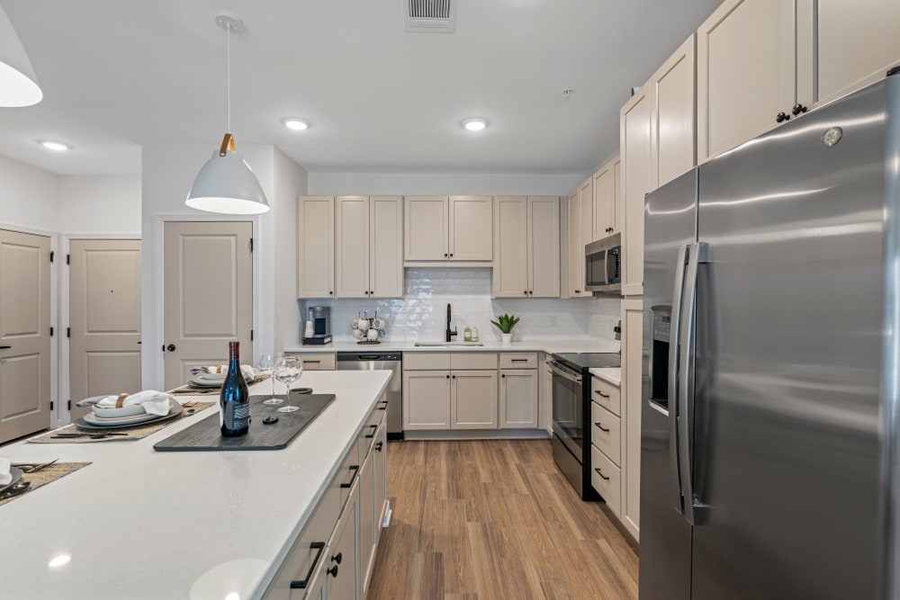 Kitchen with stainless-steel appliances at Primrose at Santa Rosa Beach in Santa Rosa Beach, Florida