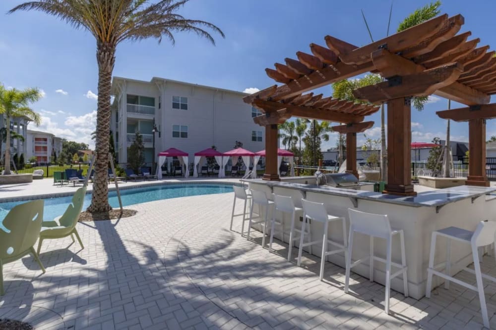 Picnic area by the pool at Makara Orlando in Orlando, Florida