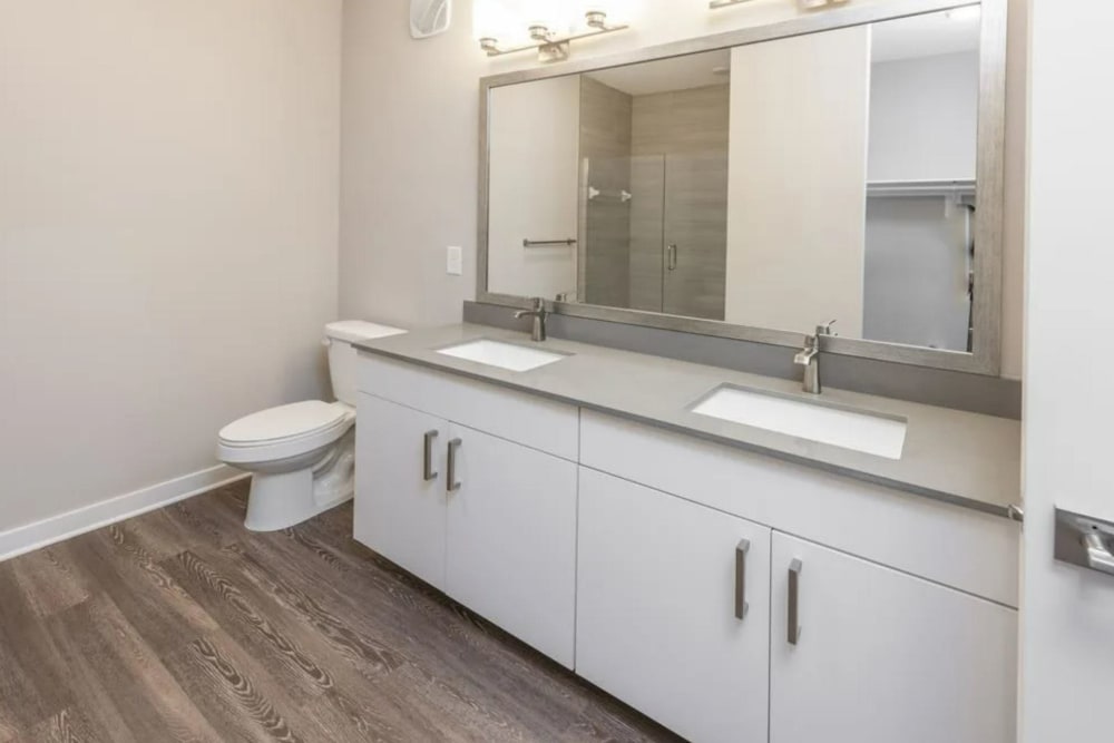 Bathroom with dual sinks at Verso Luxury Apartments in Davenport, Florida