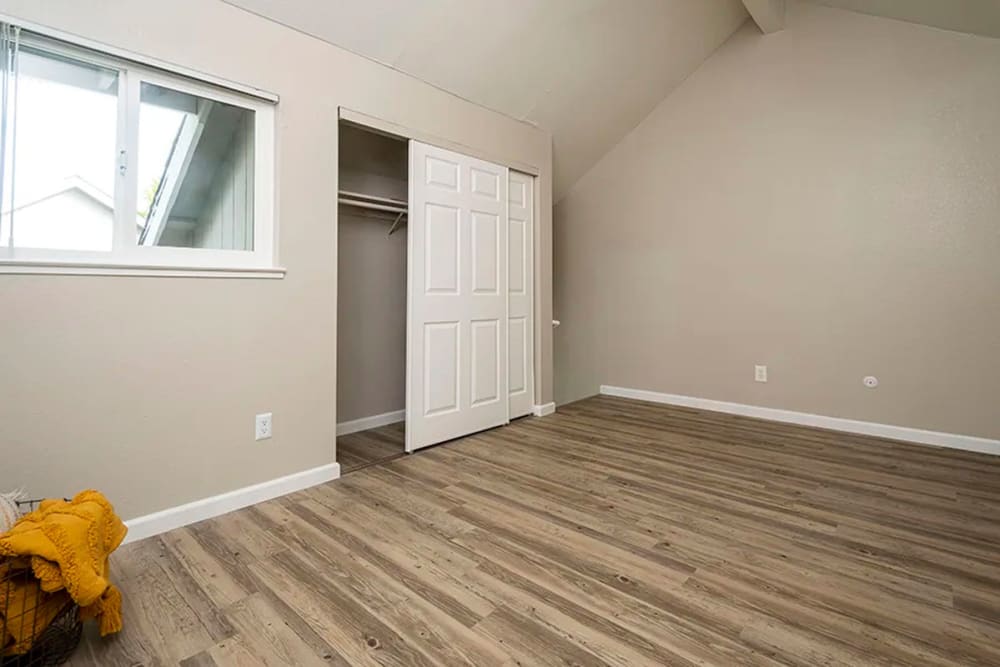 Bedroom with closet at Americana Apartments in Rohnert Park, California