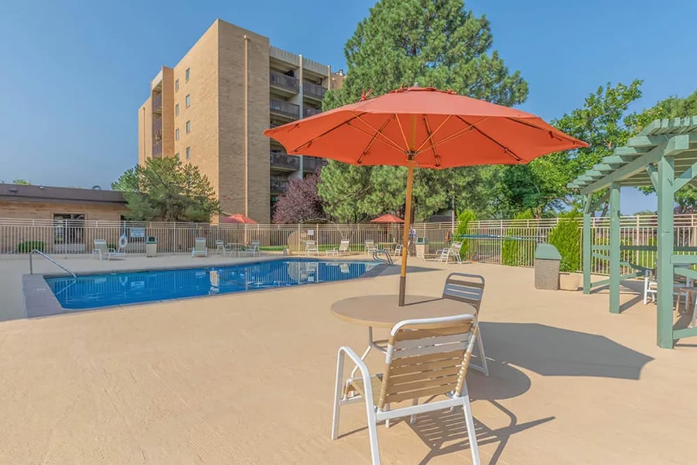 Lounge chairs by the pool at Los Altos Towers in Albuquerque, New Mexico