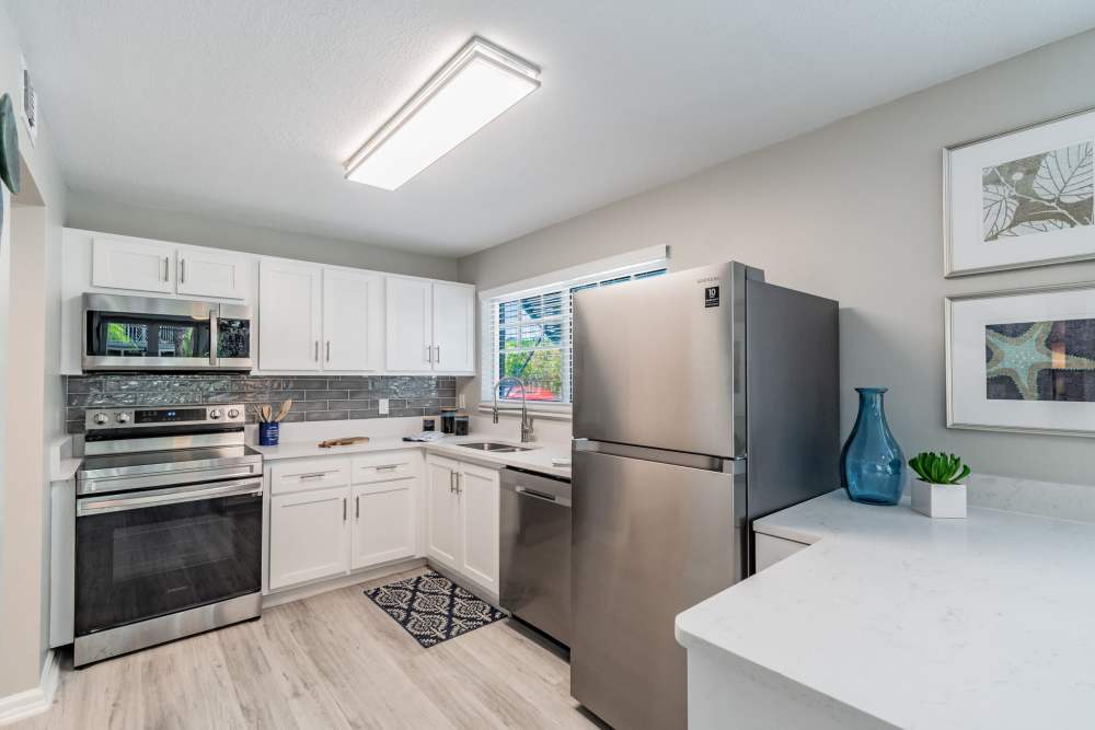 Apartment kitchen with stainless-steel appliances at Bermuda Cay in Boynton Beach, Florida