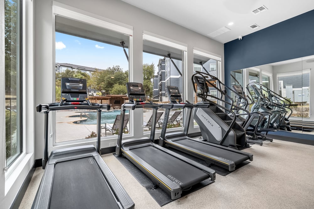 Cardio machines in the fitness center at Marquis at Crown Ridge in San Antonio, Texas