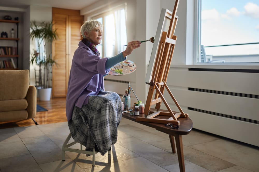 Resident painting at Regency Newcastle in Newcastle, Washington