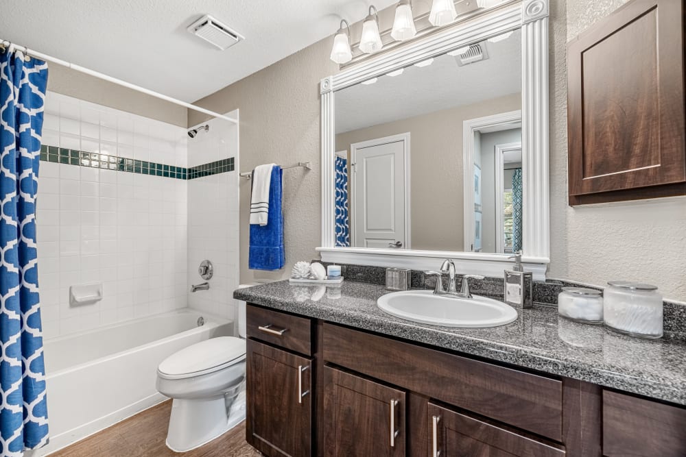 Bathroom with a bathtub and shower at Marquis at Deerfield in San Antonio, Texas