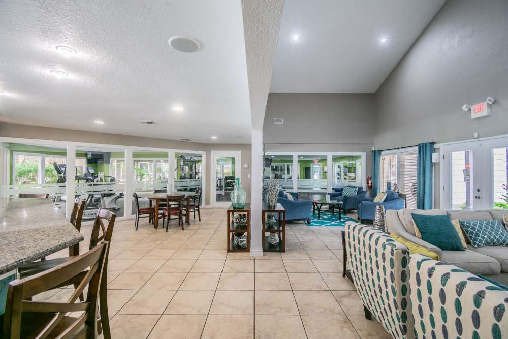 Resident clubhouse with comfy sofas at Coopers Pond in Tampa, Florida