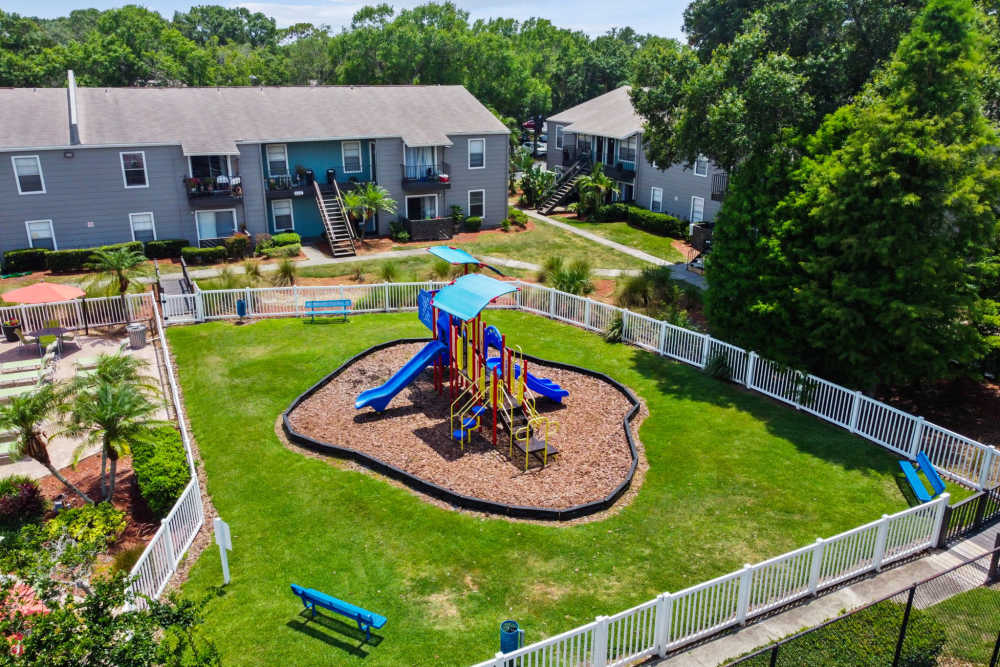 Exterior of apartment complex and children's playground at Coopers Pond in Tampa, Florida