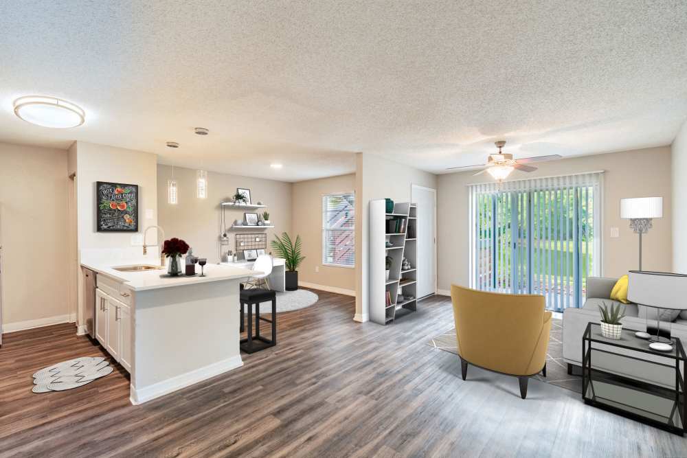 Large apartment living room with hardwood floors and modern furniture at Lakeside Central Apartments in Brandon, Florida