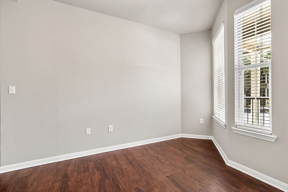 Bright, open dining room with wood floors at Marquis Bandera in San Antonio, Texas
