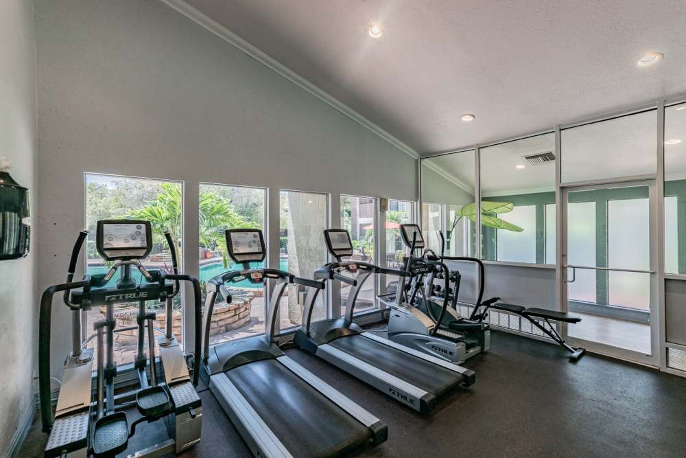 Resident fitness center with multiple treadmills at Legend Oaks in Tampa, Florida