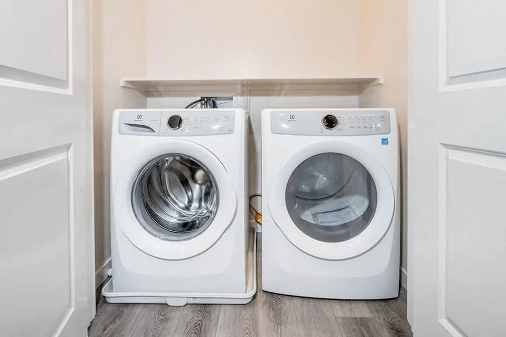  In-unit washer and dryer with extra linen storage at Hub Apartments in Folsom, California