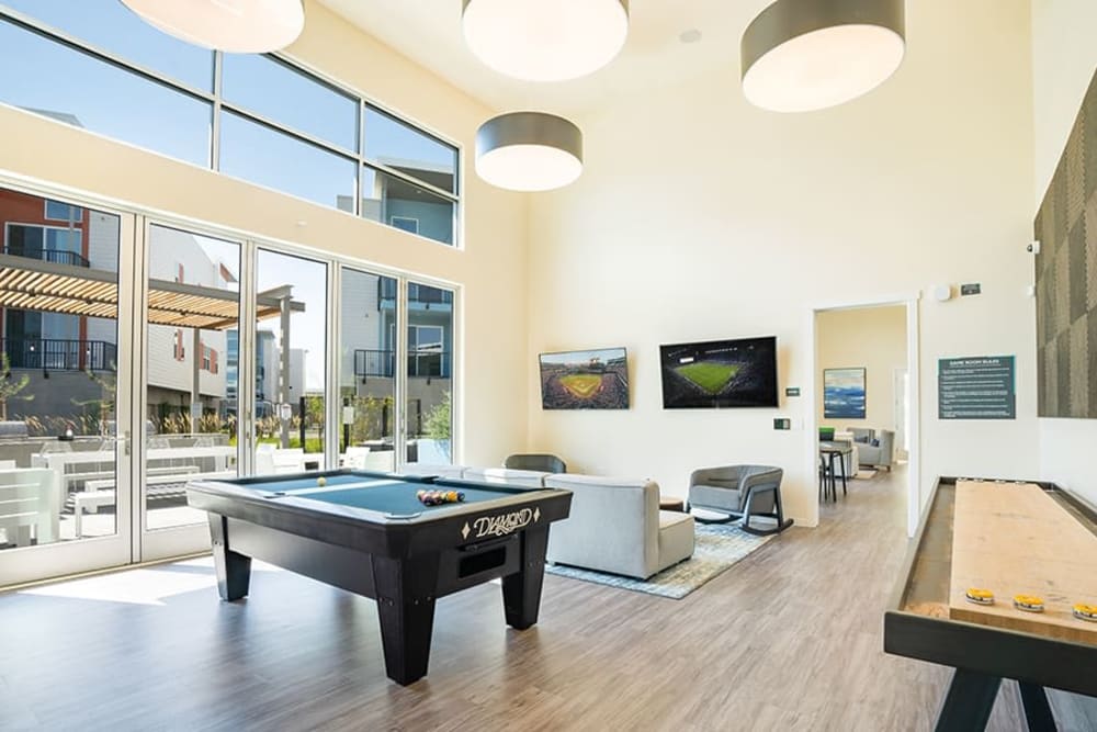 Community area with a pool table at Hub Apartments in Folsom, California