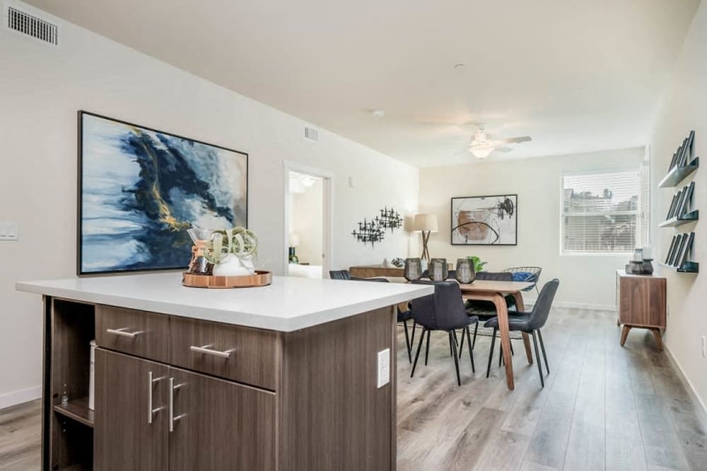 Model living space with large windows at Hub Apartments in Folsom, California
