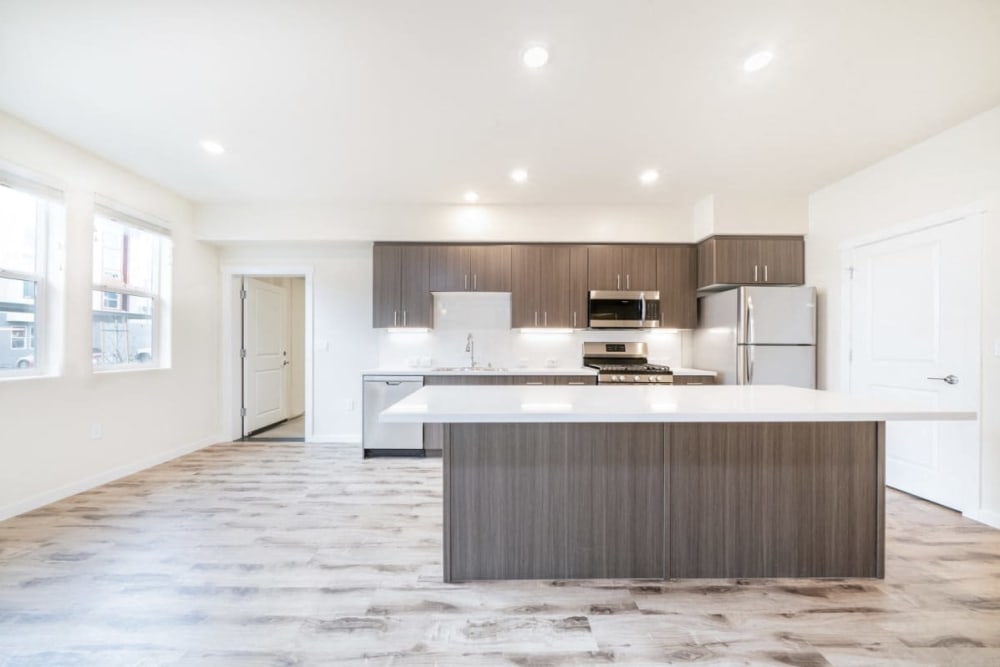Model kitchen with hardwood floors at Hub Apartments in Folsom, California