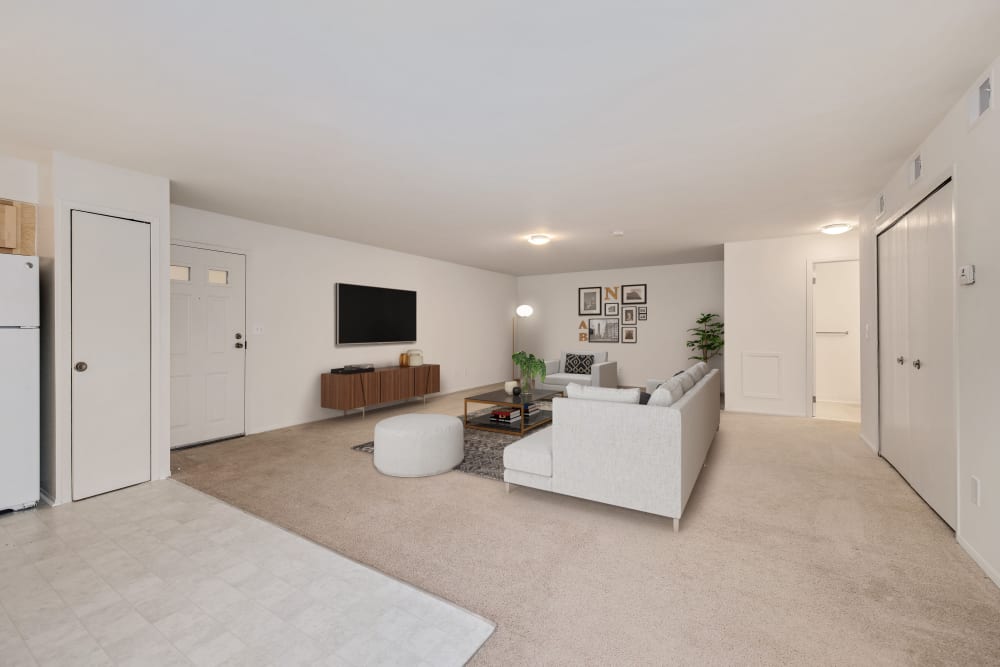 Expansive open living area of a model apartment at Farmington Oaks Apartments in Farmington, Michigan