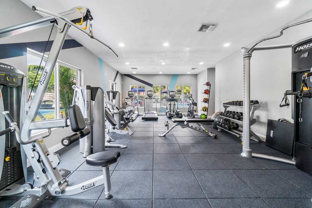 Community gym with weight machines at Boynton Place Apartments in Boynton Beach, Florida