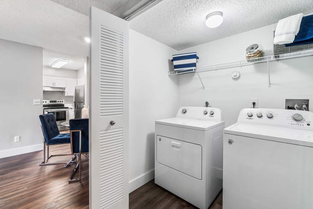 Washer and dryer in apartment at Boynton Place Apartments in Boynton Beach, Florida