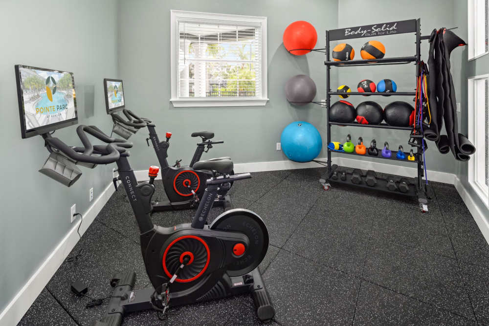 Fitness center with stationary bicycles at Pointe Parc at Avalon in Orlando, Florida