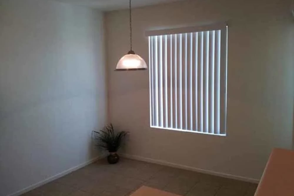 Large window in the living room at Santa Fe Apartments in Bakersfield, California
