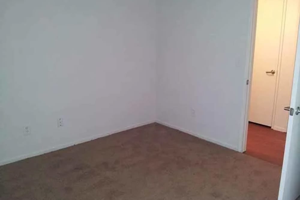 Carpeted bedroom at Santa Fe Apartments in Bakersfield, California