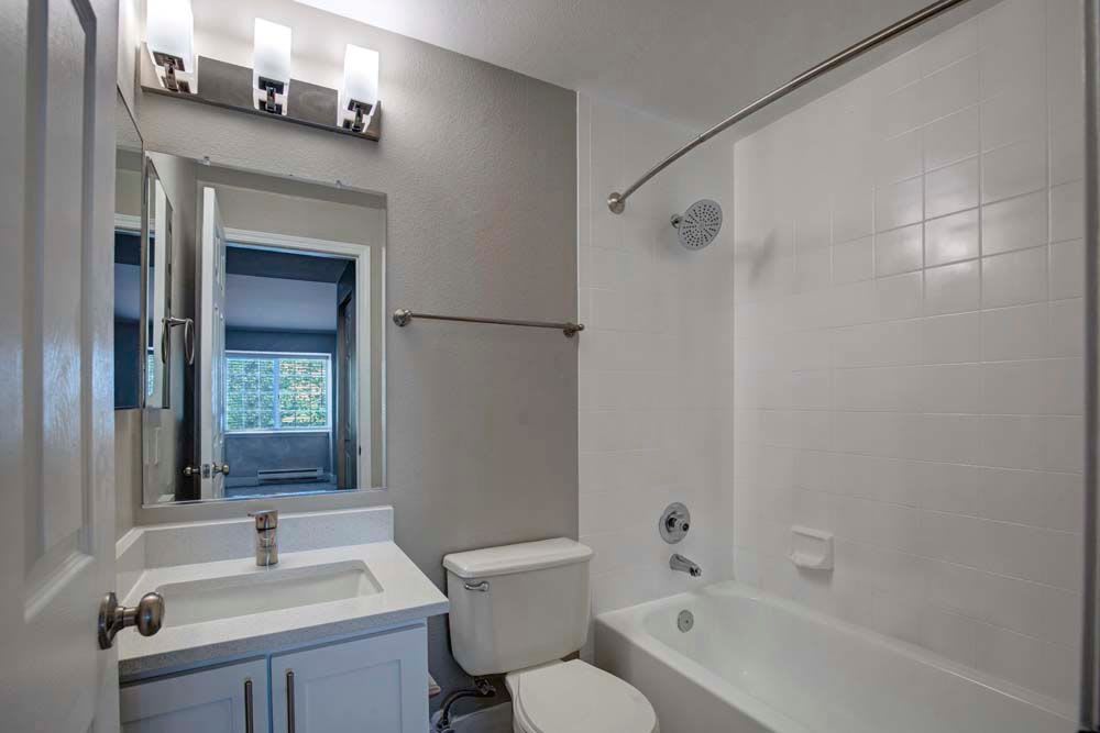Bathroom with mirror at Apartments in Kent, Washington