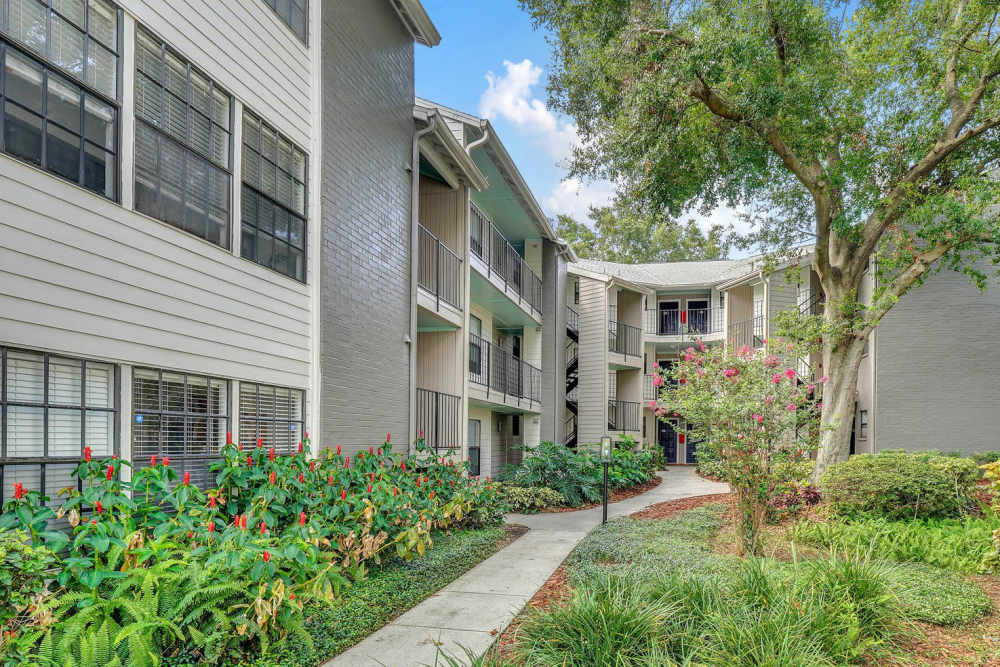 Exterior of apartments with walkways and garden at 4800 Westshore in Tampa, Florida