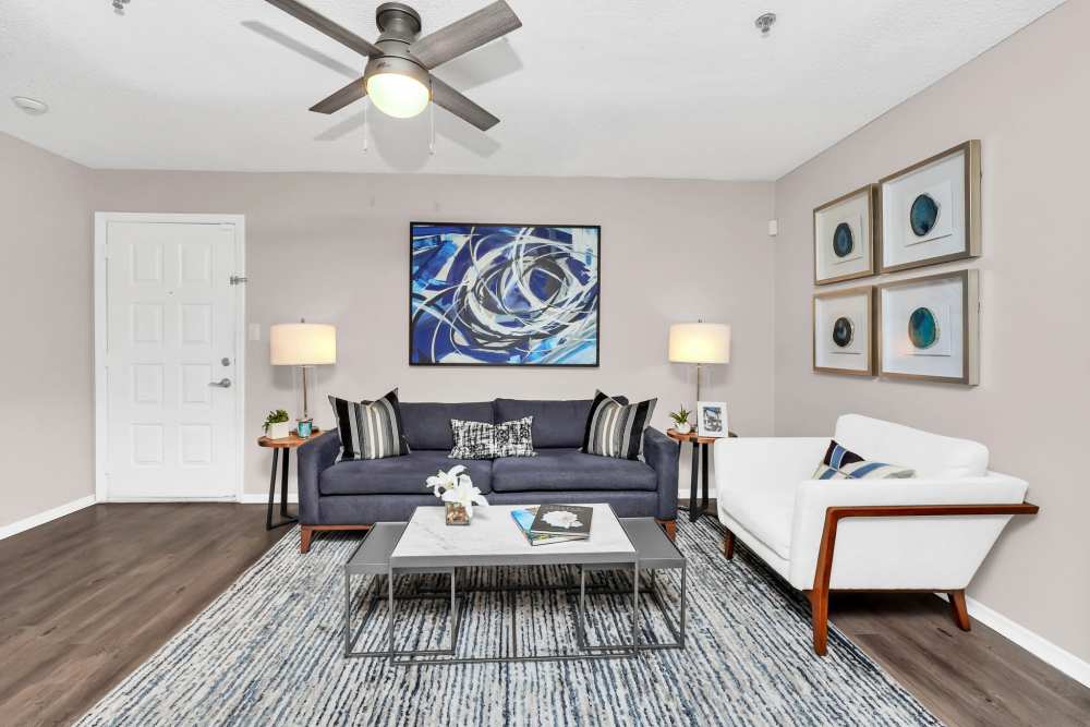 Spacious apartment living room with sofas and coffee table at 4800 Westshore in Tampa, Florida