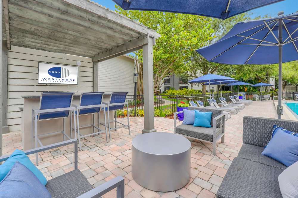 Outdoor patio with television and seating at 4800 Westshore in Tampa, Florida