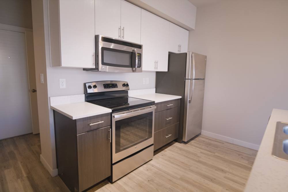 Apartment kitchen with stainless-steel appliances at College Town Fayetteville in Fayetteville, Arkansas