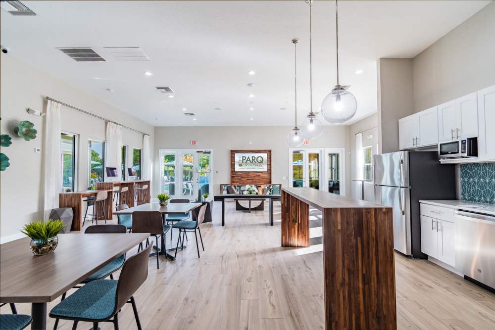 Community clubhouse with lounge and dining area at The Parq at Cross Creek in Tampa, Florida