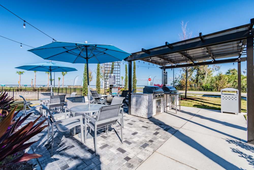 Patio table with chairs near the grilling station at Vue on Lake Monroe in Sanford, Florida