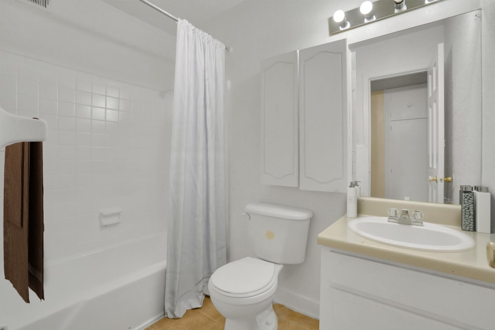 A full sized bathroom in an apartment at Rivers Edge Apartments in Jonesboro, Georgia