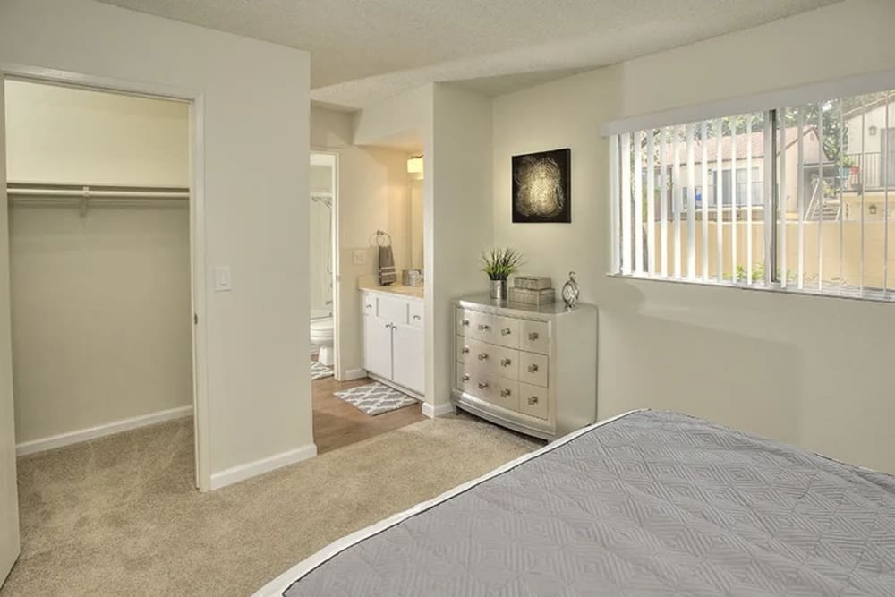 Bedroom with large windows at Creekside Gardens in Vacaville, California